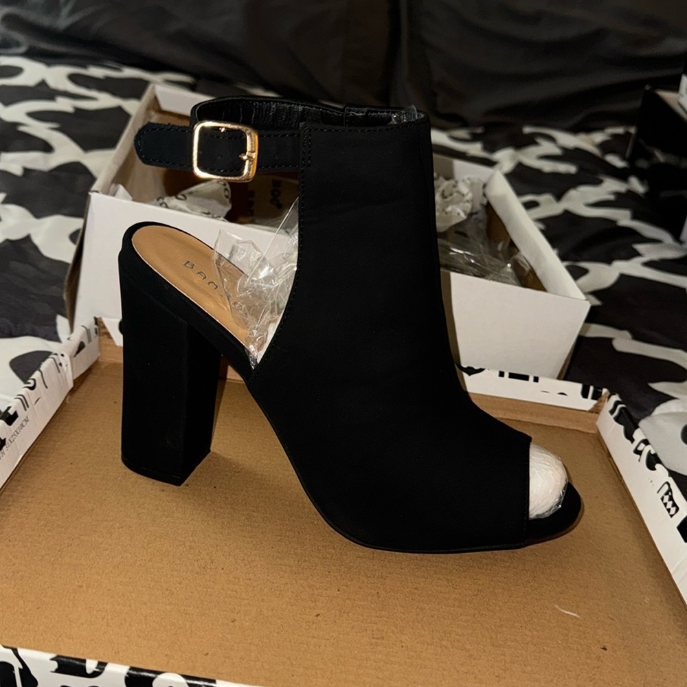 Black heels, never worn, size 8.5